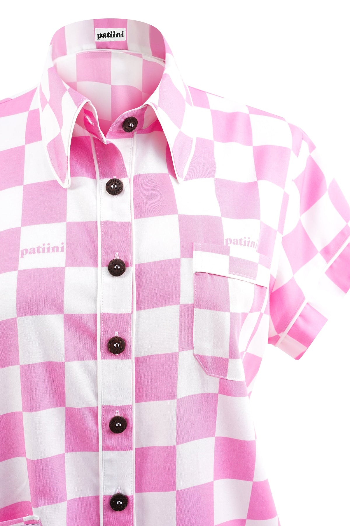 Close-up of pink and white checkered button-down shirt with coconut buttons.
