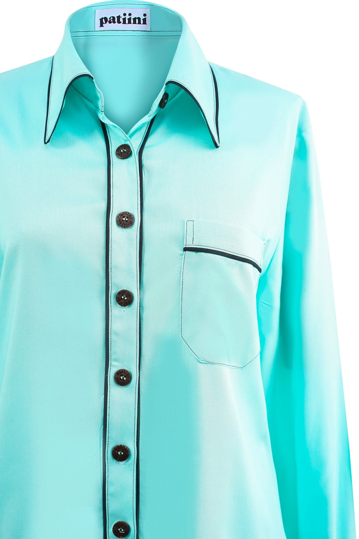 Close-up of a teal button-down shirt with coconut shell buttons.