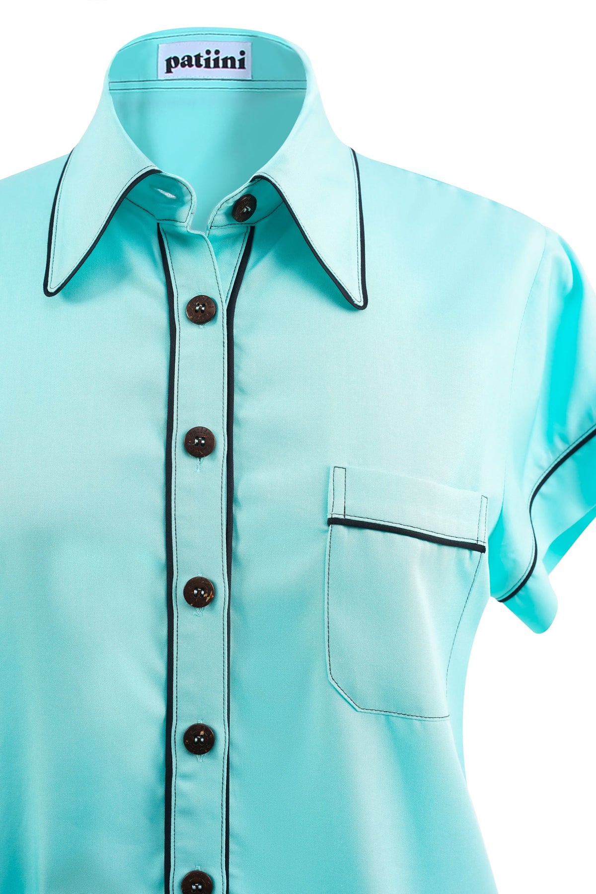 Close-up of a teal button-down shirt with coconut shell buttons.