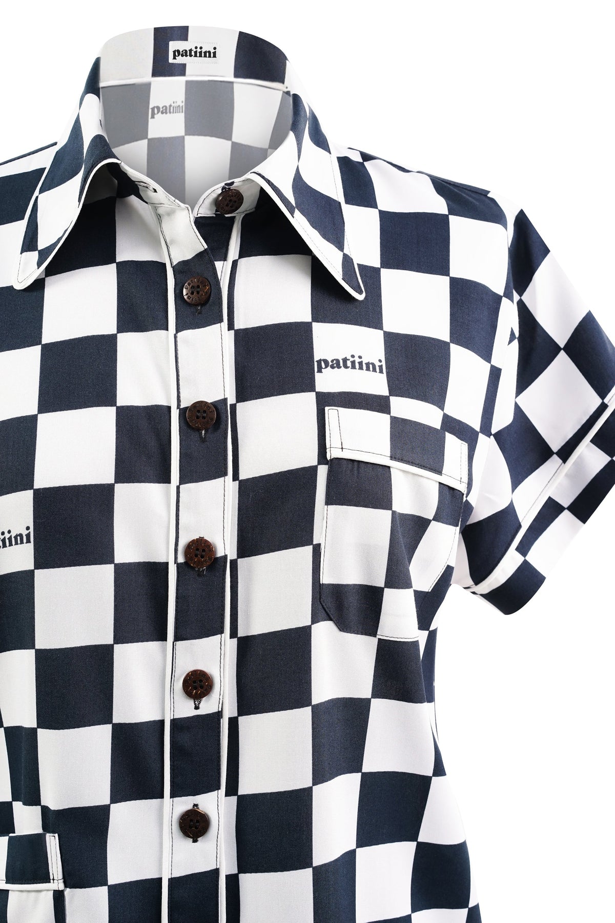 Close-up of black and white checkered button-down shirt.