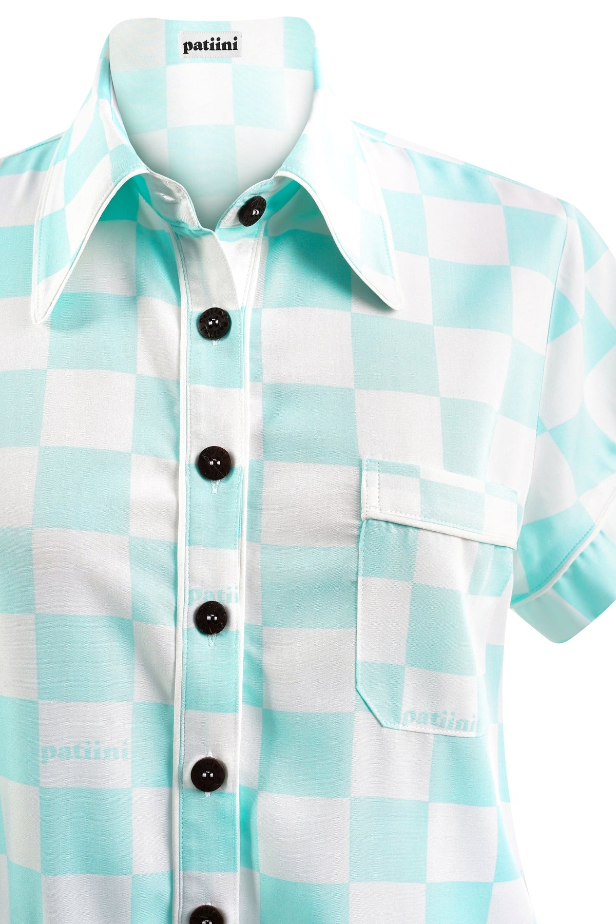 Close up of a teal and white checkered short-sleeve shirt with coconut shell buttons.