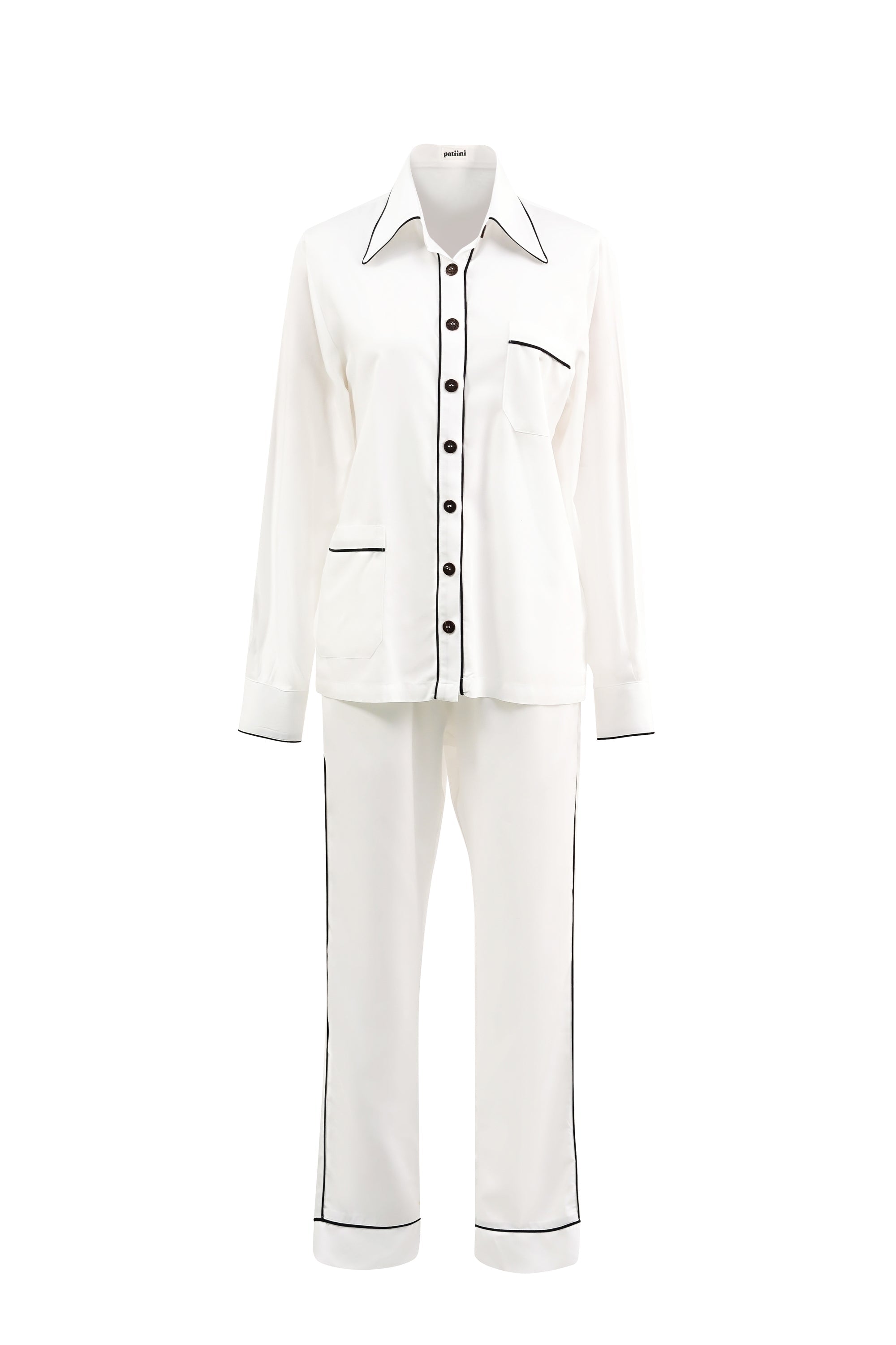 White long-sleeve pajama set with contrasting black piping.