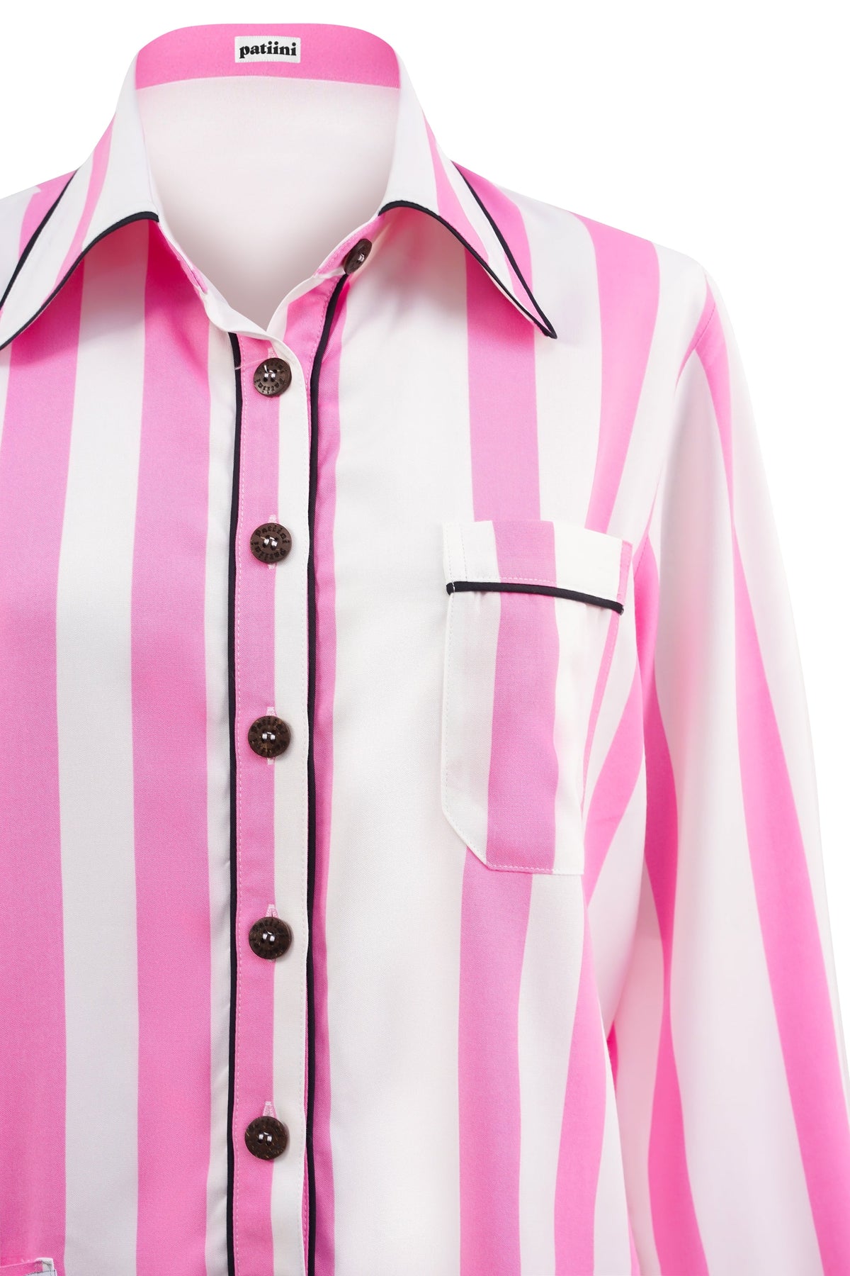 Close up of a pink and white striped long-sleeve shirt with coconut shell buttons. 
